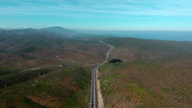 Aerial high view of the Panamericana Norte, Asphalt road along mountains of the Coquimbo region, Chile.