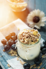 yogurt with fresh blueberry on a wooden background. healthy cereal morning breakfast,oat