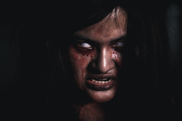 Horror bloodthirsty woman ghost or zombie she is horror scary with open mouth at dark night,...