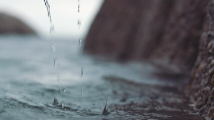 Woman hands in the water from the ocean waves with a health, relax and peaceful lifestyle. Closeup of a girl touching the calm, clean and soothing river, sea or lake to wet her skin in nature.