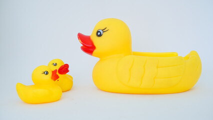Yellow rubber ducks isolated on a white background. Big rubber duck and small rubber ducks. baby and mother duck
