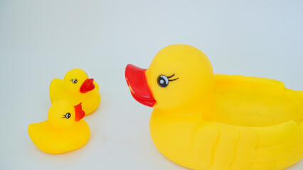 Yellow rubber ducks isolated on a white background. Big rubber duck and small rubber ducks. baby and mother duck