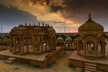 Bada Bagh or Barabagh, means Big Garden,is a garden complex in Jaisalmer, Rajasthan, India, for Royal cenotaphs of Maharajas or Kings of Jaisalmer state. Tourist attraction. Setting sun in background.