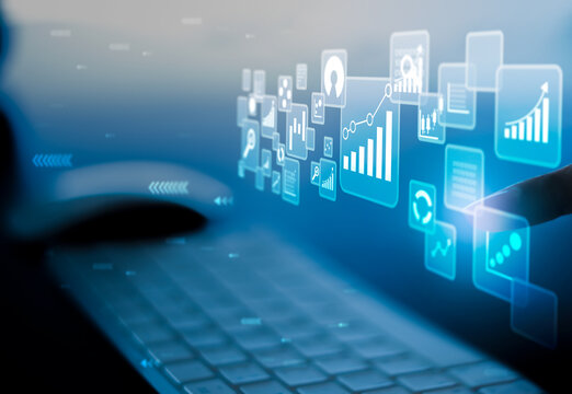 Businesswoman using laptop in data management