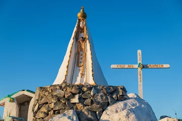 Foto op Canvas Los Roques archipelago, Venezuela, 07.30.2022: blessed virgin statue on the highest mountain of Gran Roque island. © Giongi63