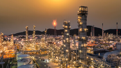 Oil and gas refinery plant form industry zone at night, Aerial view oil and gas Industrial...
