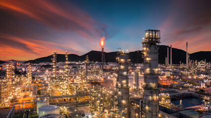 Fototapeta na wymiar Oil and gas refinery plant form industry zone at night, Aerial view oil and gas Industrial petrochemical fuel power and energy.