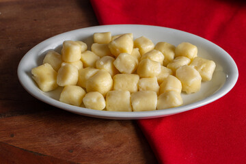 Bowl with tasty gnocchi on table