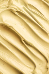Yellow icing frosting close up texture