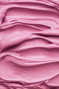 Bright pink icing frosting close up texture