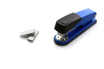 Metal Staples and blue Stapler on the white background 