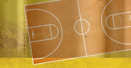 Composition of brown and white basketball court overhead view over textured yellow wall background © vectorfusionart