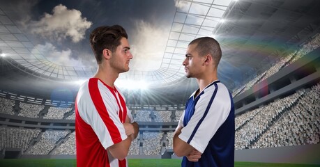 Composition of two male football players crossing arms over sports stadium