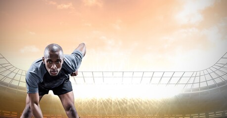 Composition of male rugby player over sports stadium