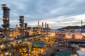 Oil and gas refinery plant form industry zone at night, Aerial view oil and gas Industrial petrochemical fuel power and energy.