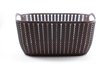 brown plastic basket with woven pattern on a white