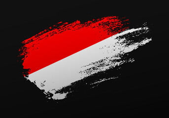 Abstract creative patriotic hand painted stain brush flag of Indonesia on black background