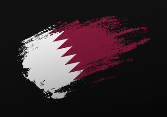 Abstract creative patriotic hand painted stain brush flag of Qatar on black background