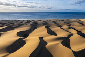 Fototapeta na wymiar Maspalomas dunes seen from above, patterns in the sand, drone photography, Gran Canaria, Spain