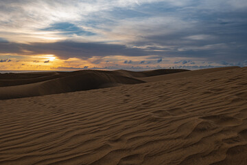 Fototapeta na wymiar Maspalomas Dunes photographed at sunrise golden hour. Gran Canaria, Spain