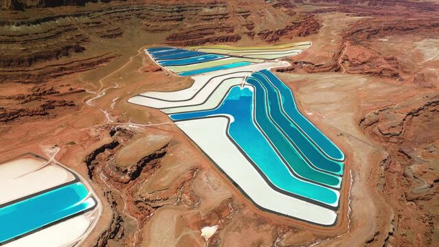 White And Blue Color Of Water In Potash Evaporation Ponds In Moab, Utah, USA. - aerial