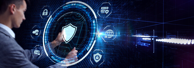 Cyber security data protection business technology privacy concept. Young businessman  select the icon security on the virtual display.