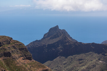 Panoramic view on sharp rock formation Roque de la Fortaleza and Pico Yeje in Teno mountain massif, Tenerife, Canary Islands, Spain, Europe. Hiking trail between village Masca and Santiago del Teide