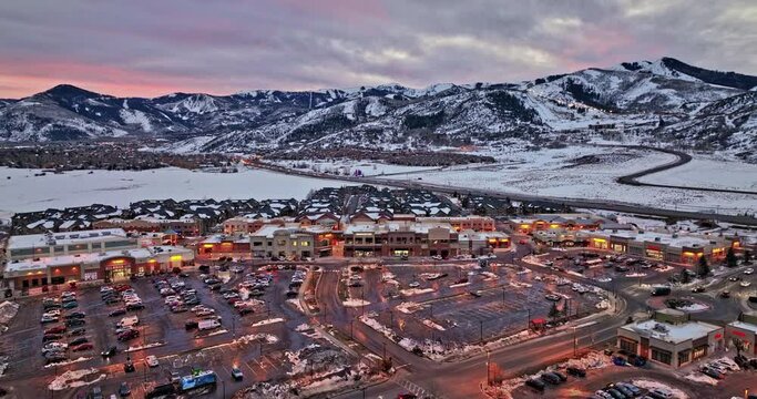 Park City Utah Aerial v27 panoramic view flyover snyderville kimball junction capturing busy town traffic surrounded by beautiful mountainscape at sunset dusk - Shot with Mavic 3 Cine - February 2022