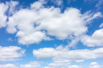 Obraz na płótnie Canvas White clouds against the blue sky.