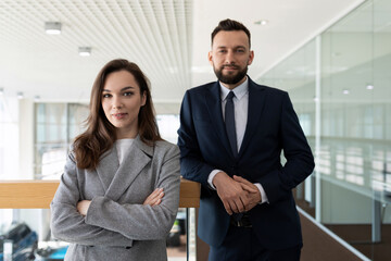 portrait of a man and a woman in formal clothes representative employees of the company, concept of legal services