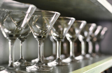 Glass tableware in a wooden vintage cupboard