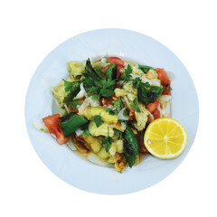 Salad of roasted eggplant, tomato, onion, parsley and peppers on a white plate.
