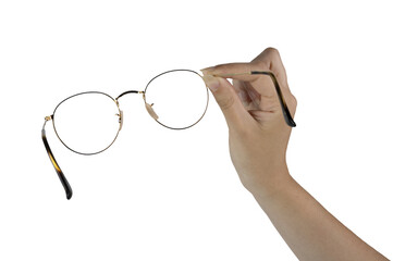 a pair of eyeglasses in the female hand on a transparent background