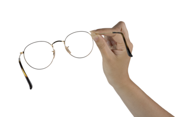 a pair of eyeglasses in the female hand on a transparent background