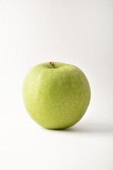 Detail of green apple on white background