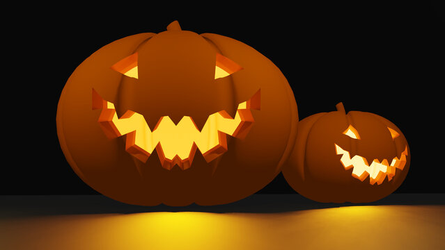 two halloween pumpkin jack o lantern scary face with light glowing inside in the black background