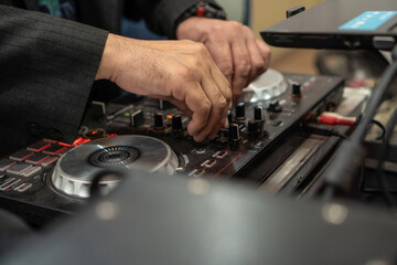 Obraz premium dj with sound console close-up
