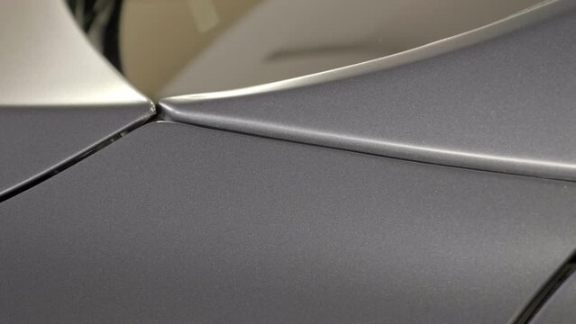 Close Up Car Parts Wrapped with Paint Protection Wrapping Foil.