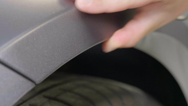 Wrapping Car Wrap Foil around Wheel Well and Pressing it by Hand, CU