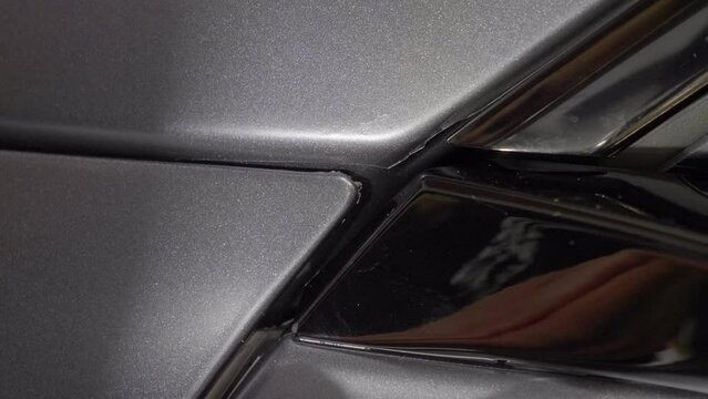 Detailing Car Wrapping Coating with Small Plastic Tool, Static Closeup