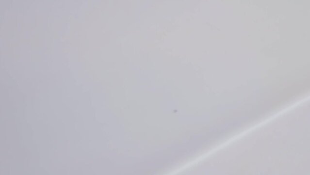 Close Up Hands Marking Distance on White Paper with Measuring Tape.