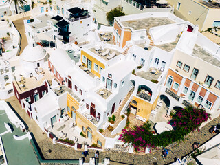 Fototapeta na wymiar Santorini Aerial View. Picturesque Fira City. Traditional Architecture. White Houses. Greece, Europe.