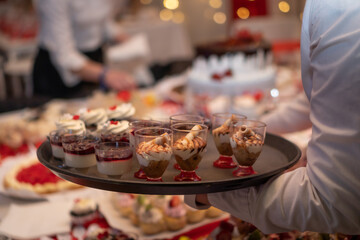 waiters serving desserts