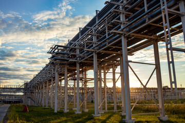 The building of an industrial enterprise in the sunset sunlight. A beautiful horizontal photograph of an industrial landscape.