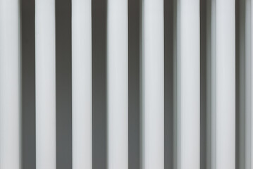 Pattern from a tubular white radiator. Saving money, economic crisis, rising prices.