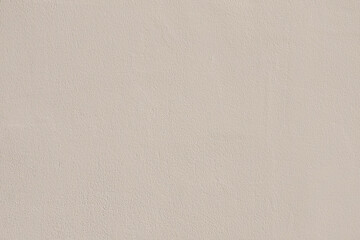 Saturated pastel gray beige colored low contrast Concrete textured background. Empty colourful wall...