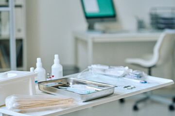 Close-up of medical supplies on table at clinic preparing for medical procedure