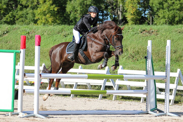 A girl and her horse in show jumping, Gotland Sweden.