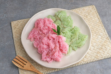 Kue Bikang or Carabikang is one of the traditional cakes typical of Central Java, Indonesia which is made from rice flour dough and coconut milk. Served in plate. 