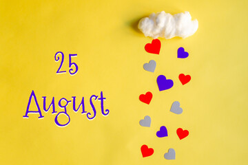 25 august day of month, colorful hearts rain from a white cotton cloud on a yellow background....